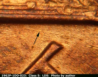 Die-stage C marker on 1962P•1DO•023 (1962 Doubled Die Obverse).