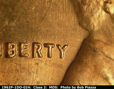 Die-stage B marker on 1962P•1DO•024 (1962 Doubled Die Obverse).