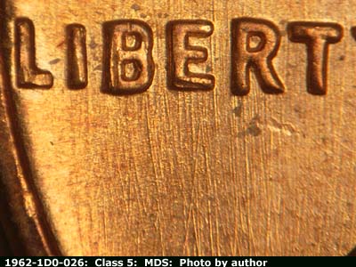 Die-stage B marker on 1962P•1DO•026 (1962 Doubled Die Obverse).
