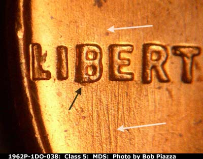 Die-stage B marker on 1962P•1DO•038 (1962 Doubled Die Obverse).