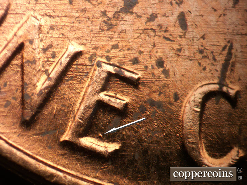 Die-stage B marker on 1962P•1DO•042 (1962 Doubled Die Obverse).