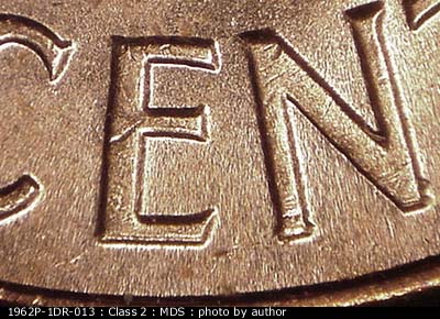 Die-stage B marker on 1962P•1DR•013 (1962 Doubled Die Reverse).