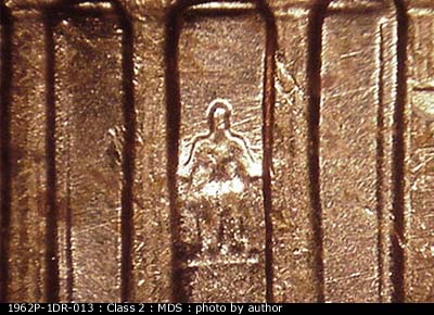 Die-stage B marker on 1962P•1DR•013 (1962 Doubled Die Reverse).