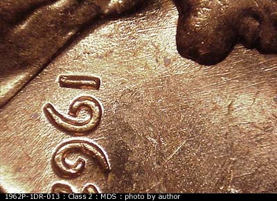 Die-stage B marker on 1962P•1DR•013 (1962 Doubled Die Reverse).