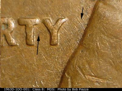 Die-stage B marker on 1963D•1DO•001 (1963 Doubled Die Obverse).