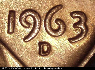 Die-stage C marker on 1963D•1DO•001 (1963 Doubled Die Obverse).