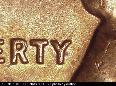 Die-stage C marker on 1963D•1DO•001 (1963 Doubled Die Obverse).