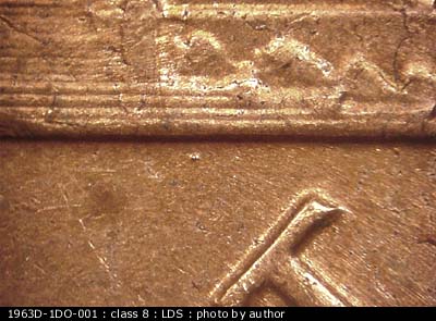 Die-stage C marker on 1963D•1DO•001 (1963 Doubled Die Obverse).