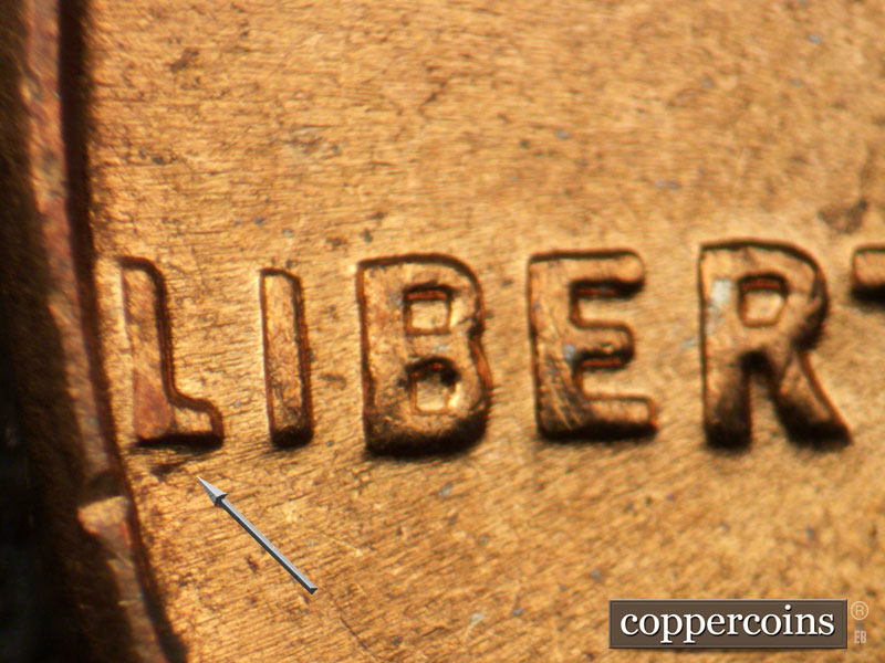 Die-stage C marker on 1963D•1DO•003 (1963 Doubled Die Obverse).