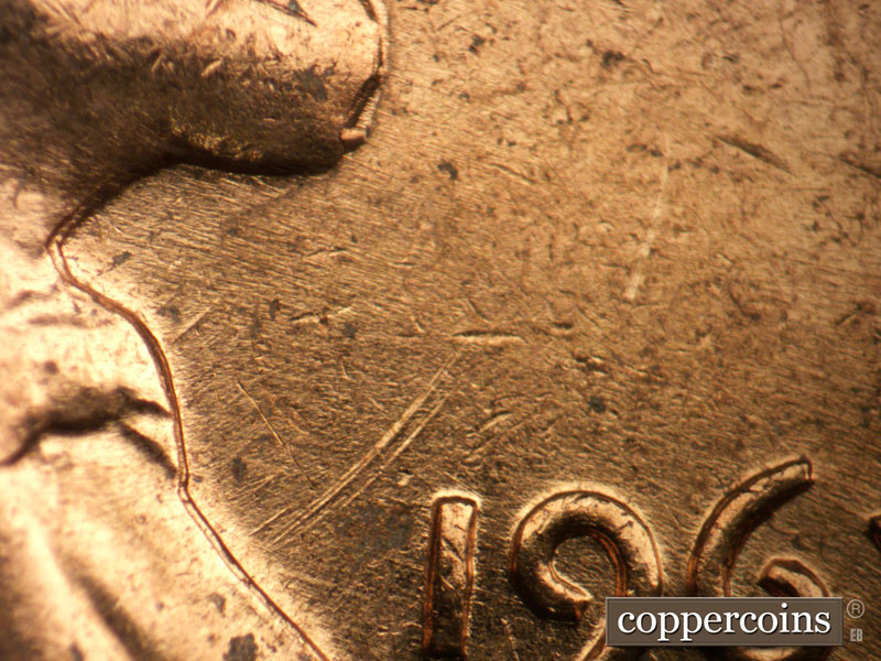 Die-stage B marker on 1963D•1DO•017 showing Strong and obvious die markers are seen here extending from Lincoln's coat to the northeast.