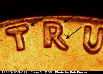 Die-stage B marker on 1963D•1DO•021 (1963 Doubled Die Obverse).