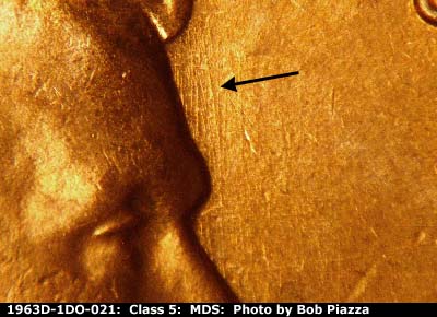 Die-stage B marker on 1963D•1DO•021 (1963 Doubled Die Obverse).