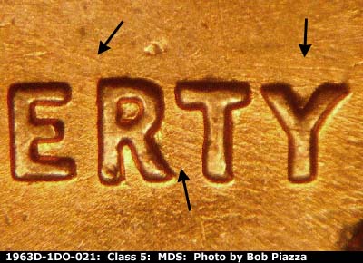 Die-stage B marker on 1963D•1DO•021 (1963 Doubled Die Obverse).