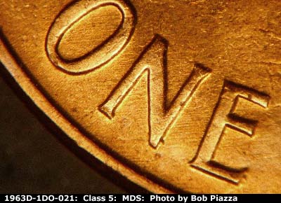 Die-stage B marker on 1963D•1DO•021 (1963 Doubled Die Obverse).