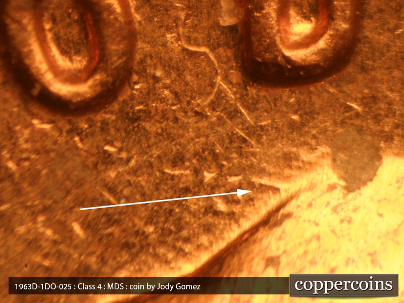 Die-stage B marker on 1963D•1DO•025 (1963 Doubled Die Obverse).