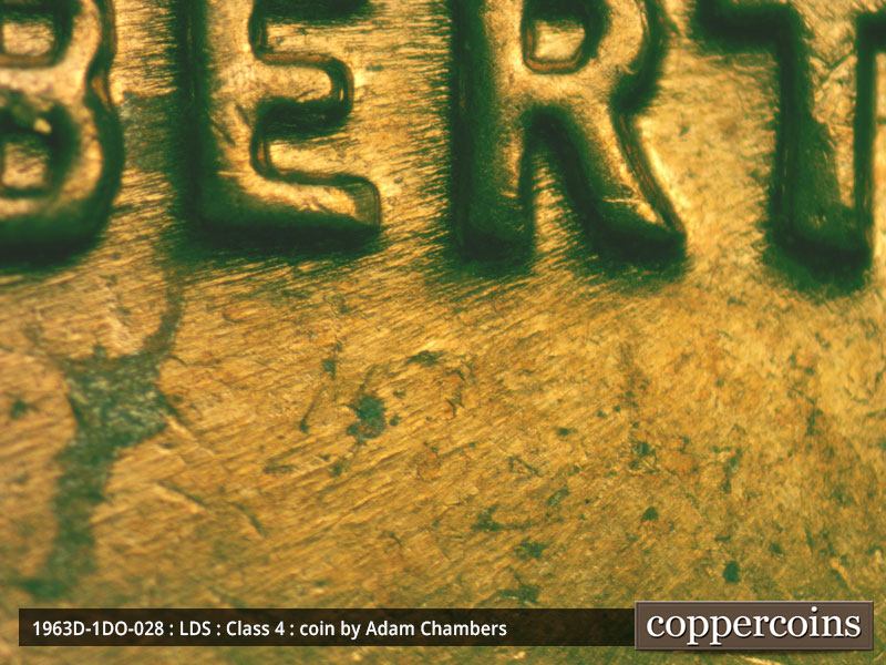 Die-stage B marker on 1963D•1DO•028 (1963 Doubled Die Obverse).