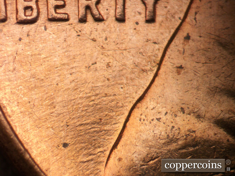 Die-stage B marker on 1963D•1DO•038 (1963 Doubled Die Obverse).
