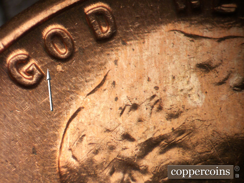 Die-stage B marker on 1963D•1DO•038 (1963 Doubled Die Obverse).