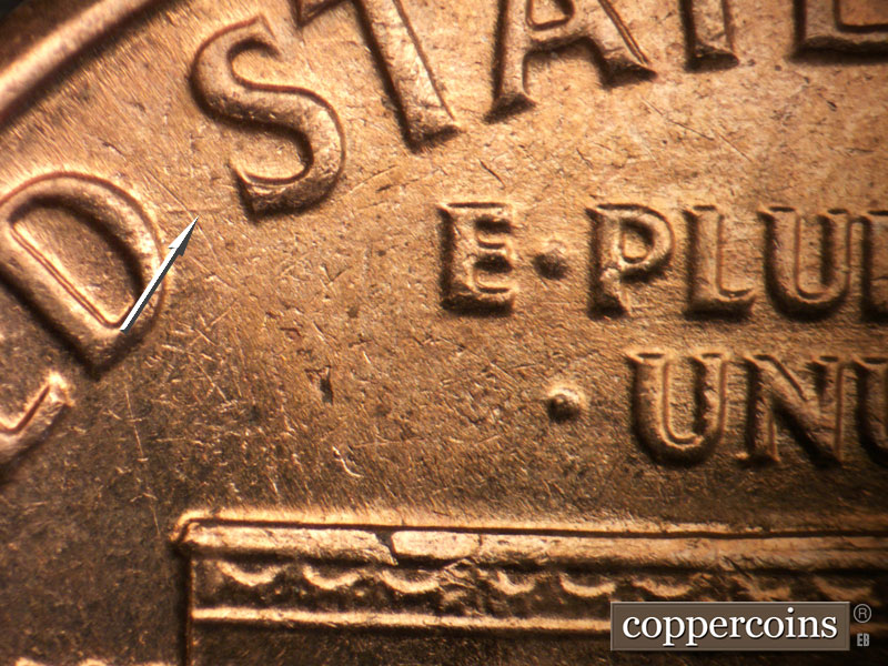 Die-stage B marker on 1963D•1DO•038 (1963 Doubled Die Obverse).
