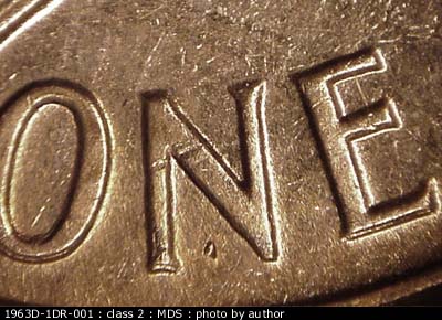 Die-stage B marker on 1963D•1DR•001 (1963 Doubled Die Reverse).