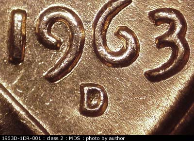 Die-stage B marker on 1963D•1DR•001 (1963 Doubled Die Reverse).