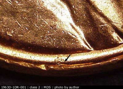 Die-stage B marker on 1963D•1DR•001 (1963 Doubled Die Reverse).