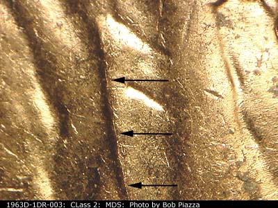 Die-stage B marker on 1963D•1DR•003 (1963 Doubled Die Reverse).