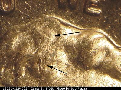 Die-stage B marker on 1963D•1DR•003 (1963 Doubled Die Reverse).