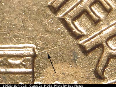 Die-stage B marker on 1963D•1DR•003 (1963 Doubled Die Reverse).
