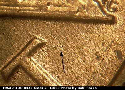 Die-stage B marker on 1963D•1DR•004 (1963 Doubled Die Reverse).