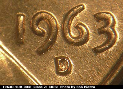 Die-stage B marker on 1963D•1DR•004 (1963 Doubled Die Reverse).