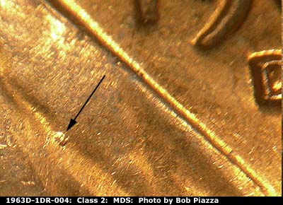 Die-stage B marker on 1963D•1DR•004 (1963 Doubled Die Reverse).