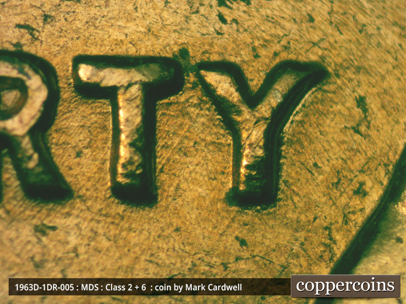 Die-stage B marker on 1963D•1DR•005 (1963 Doubled Die Reverse).