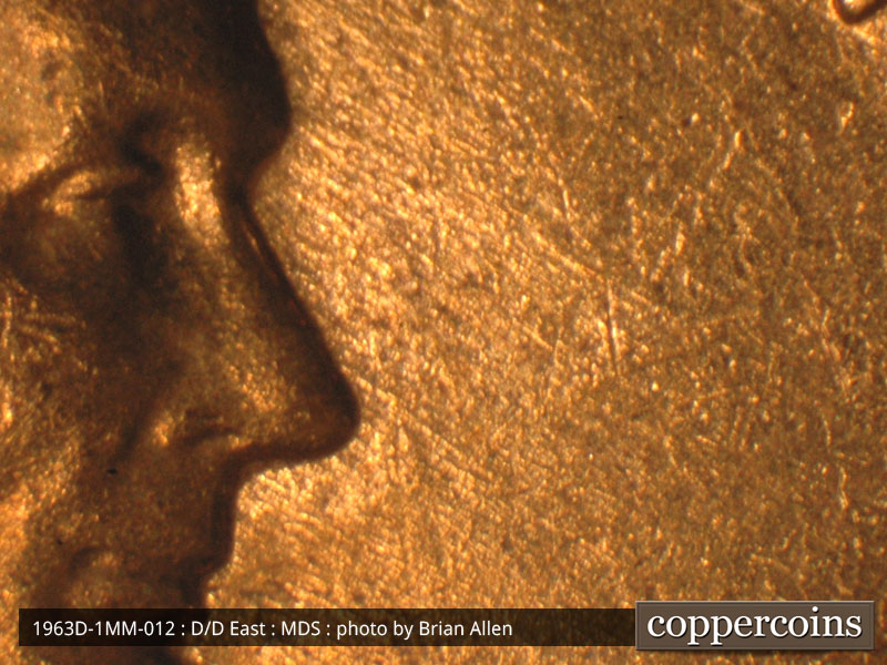 Die-stage B marker on 1963D•1MM•012 (1963 Repunched Mint Mark).