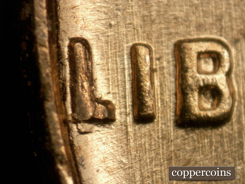 Die-stage A marker on 1963P•1DO•008 (1963 Doubled Die Obverse).