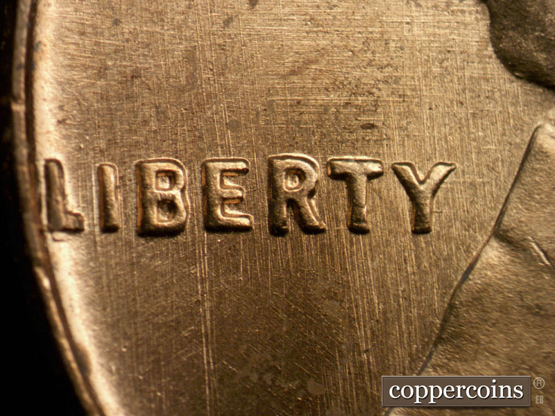 Die-stage A marker on 1963P•1DO•008 (1963 Doubled Die Obverse).
