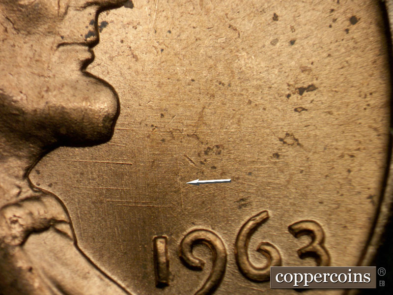 Die-stage B marker on 1963P•1DO•009 (1963 Doubled Die Obverse).
