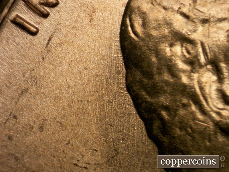 Die-stage B marker on 1963P•1DO•009 (1963 Doubled Die Obverse).