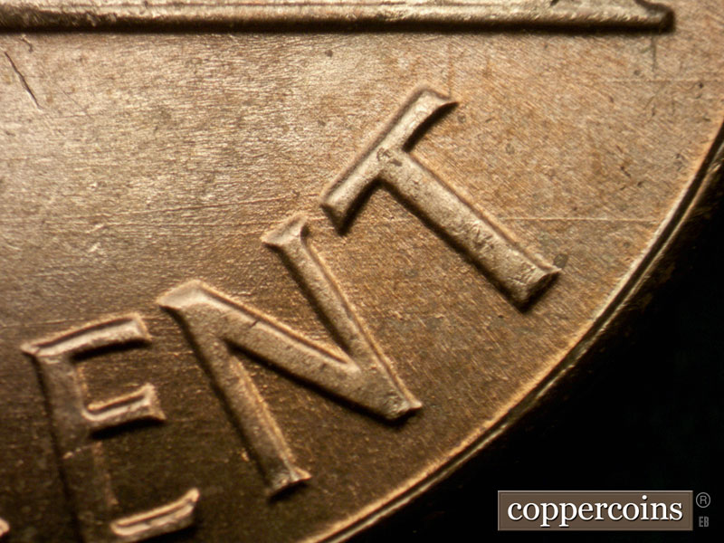 Die-stage B marker on 1963P•1DO•009 (1963 Doubled Die Obverse).