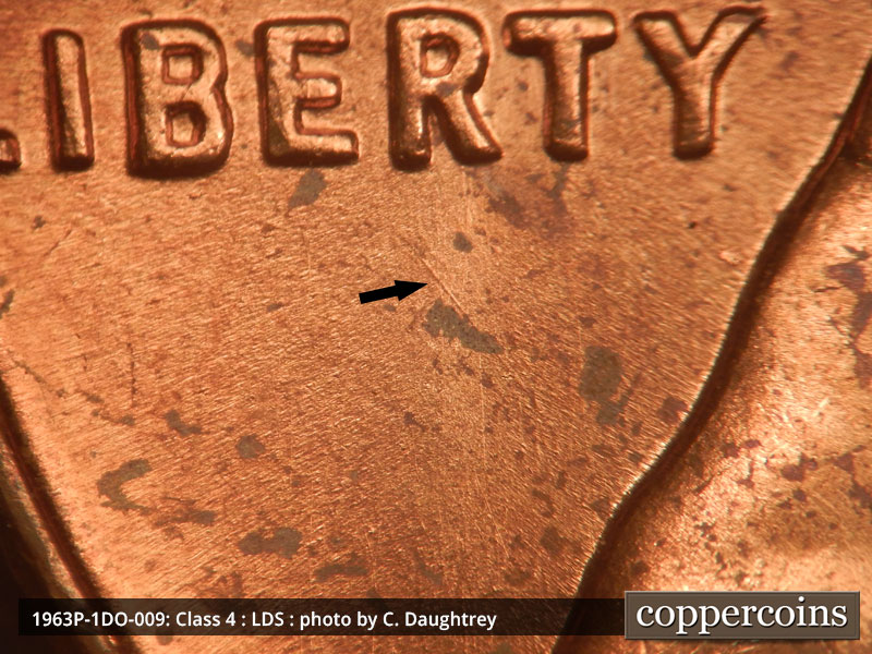 Die-stage C marker on 1963P•1DO•009 (1963 Doubled Die Obverse).