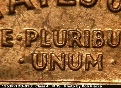 Die-stage B marker on 1963P•1DO•010 (1963 Doubled Die Obverse).