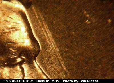 Die-stage B marker on 1963P•1DO•012 (1963 Doubled Die Obverse).