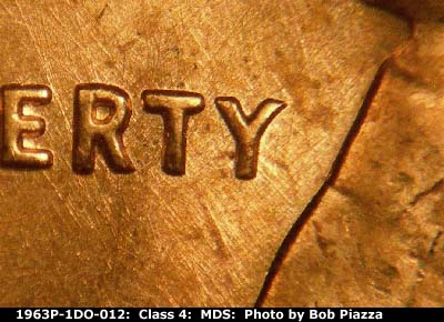Die-stage B marker on 1963P•1DO•012 (1963 Doubled Die Obverse).