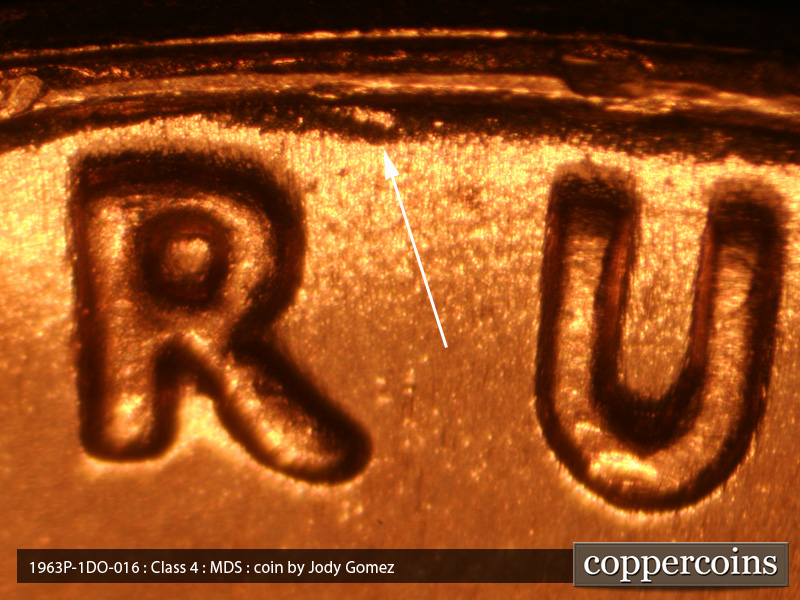 Die-stage B marker on 1963P•1DO•016 (1963 Doubled Die Obverse).