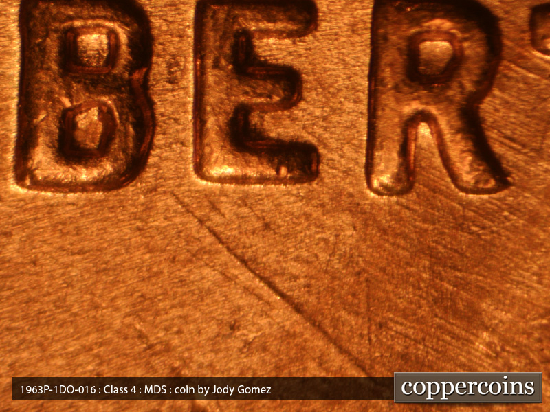 Die-stage B marker on 1963P•1DO•016 (1963 Doubled Die Obverse).