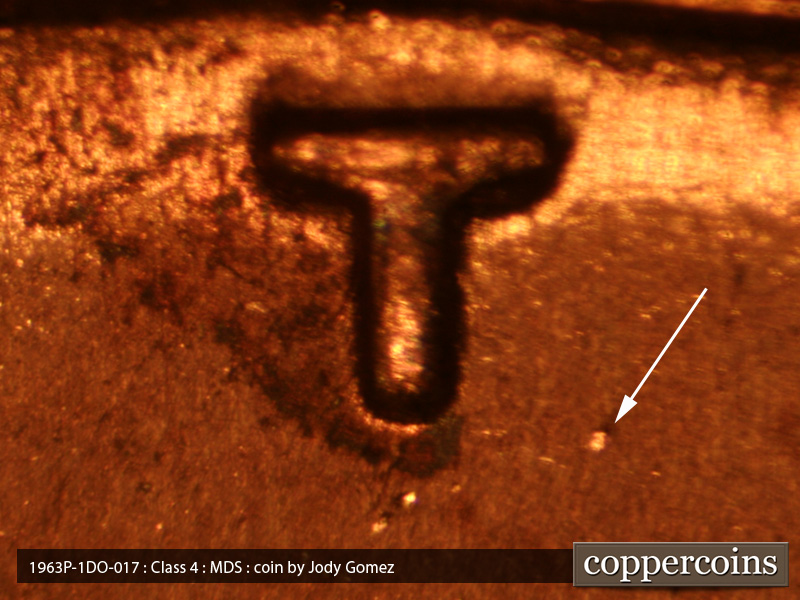 Die-stage B marker on 1963P•1DO•018 (1963 Doubled Die Obverse).