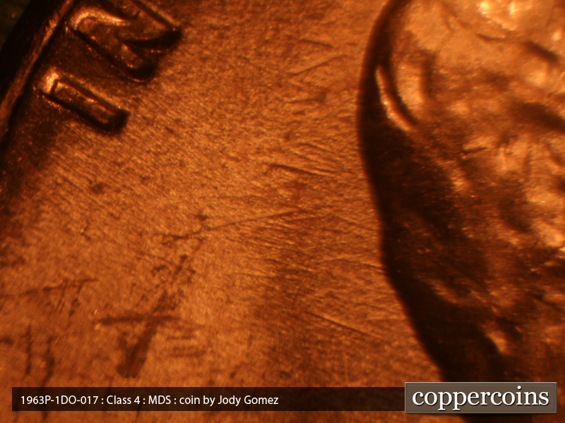 Die-stage B marker on 1963P•1DO•018 (1963 Doubled Die Obverse).
