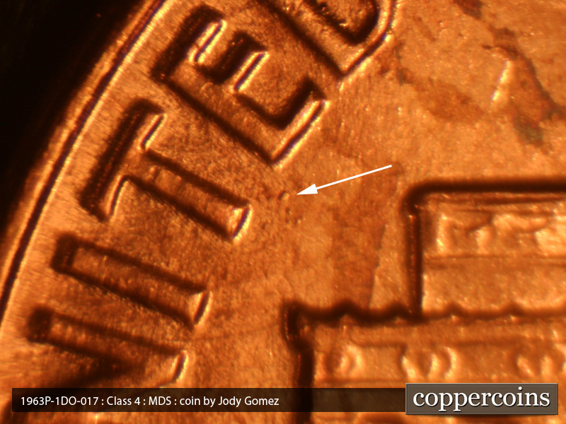 Die-stage B marker on 1963P•1DO•018 (1963 Doubled Die Obverse).