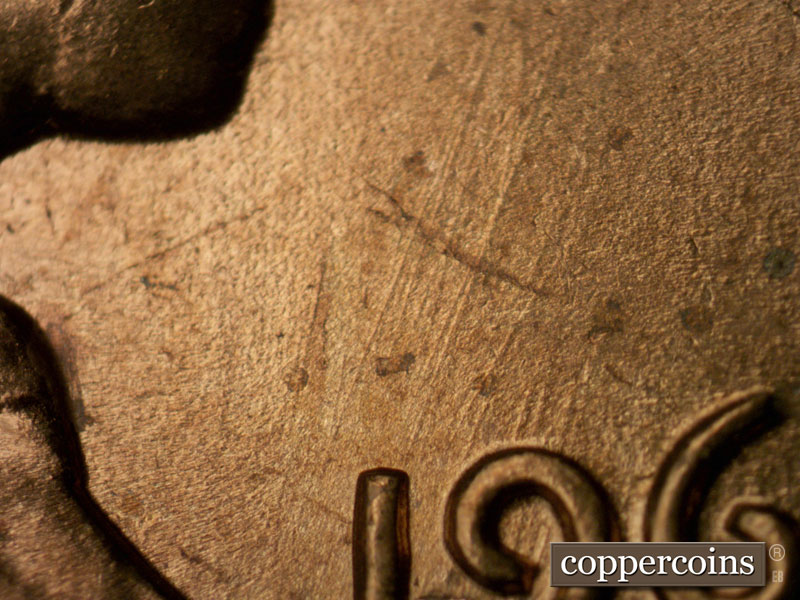 Die-stage B marker on 1963P•1DO•021 (1963 Doubled Die Obverse).