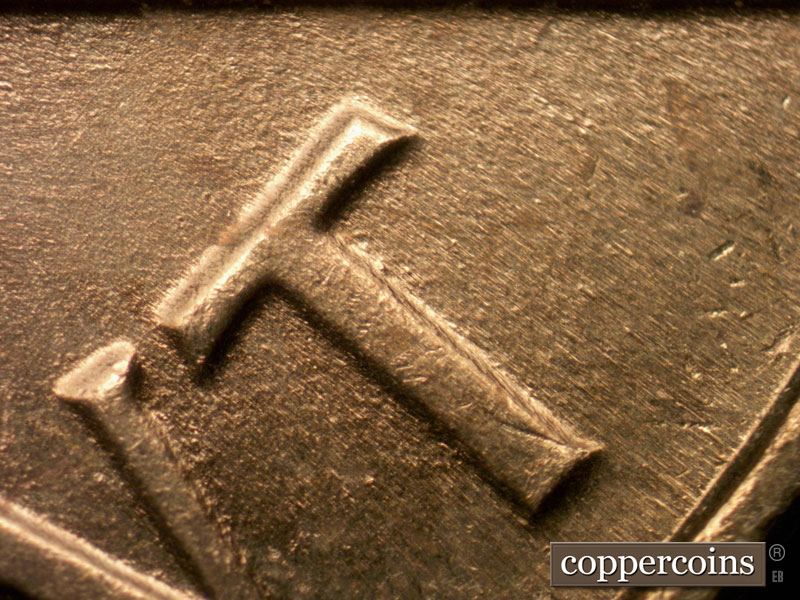 Die-stage B marker on 1963P•1DO•021 (1963 Doubled Die Obverse).